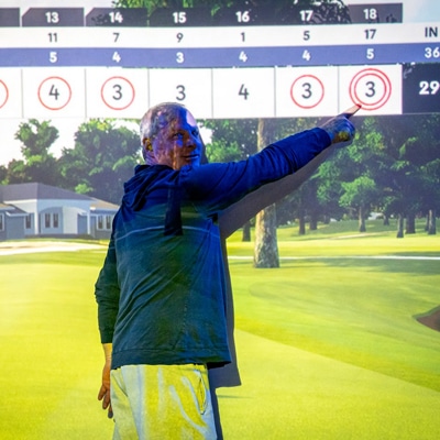 Golfer addressing the ball in a bay