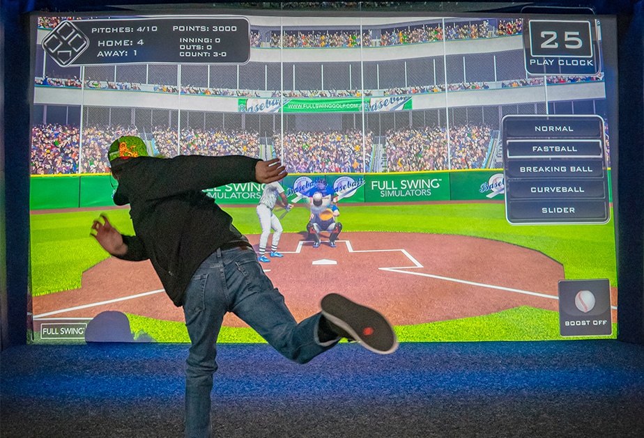 Guests playing an arcade sports game on the simulator