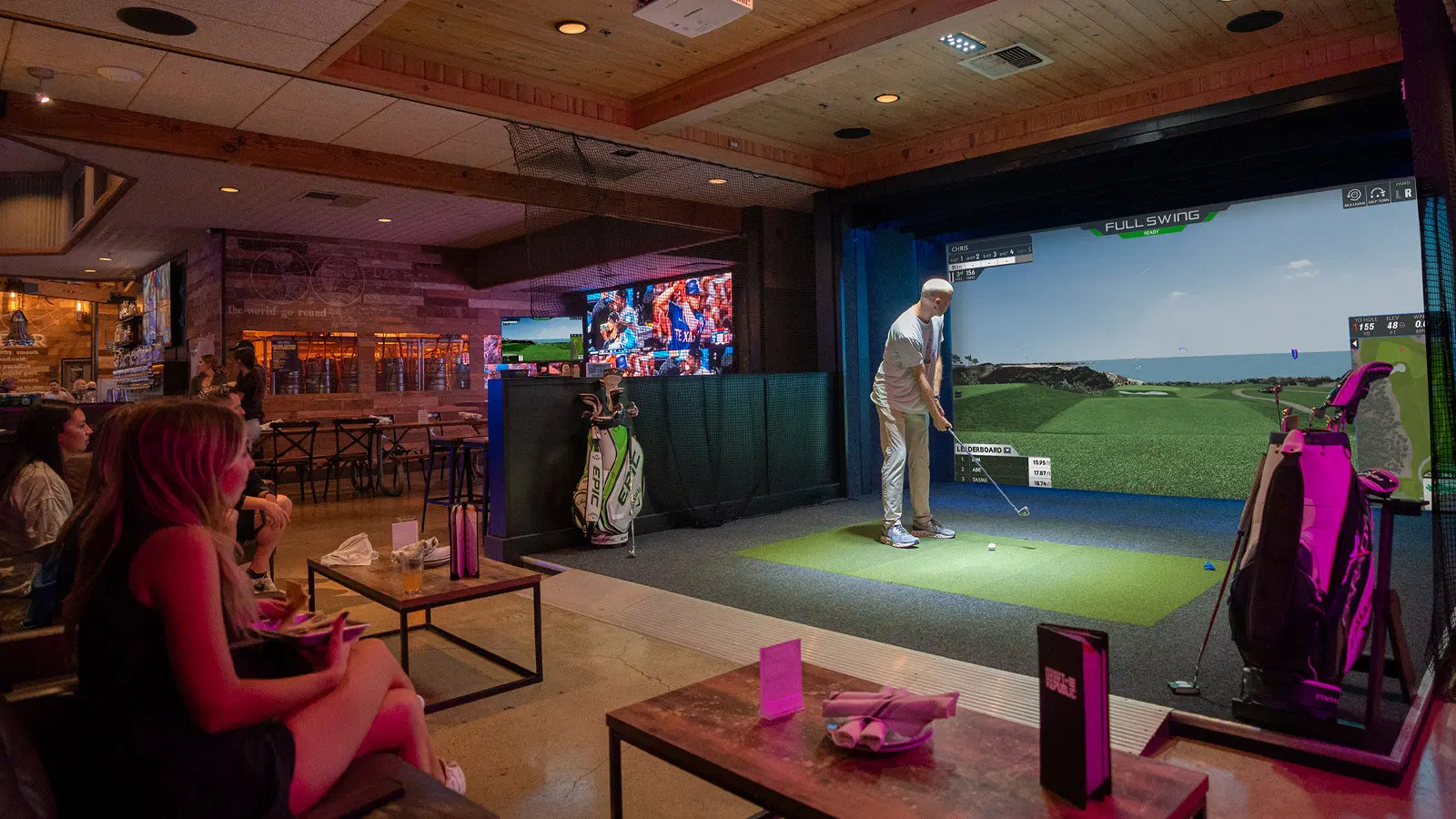 Indoor golf simulator bays