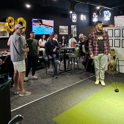 Guests playing in a simulator bay